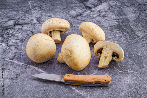 Mushrooms in detail and next to a knife
