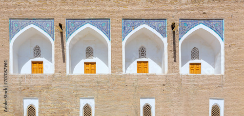 White niches of the cells at the facade of Muhammad Amin Khan medrese. Fragment of facade. Khiva. Uzbekistan photo