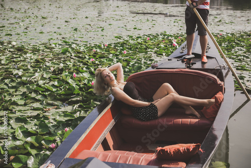 Concept of peaceful and relax. European lady in gondola resting
