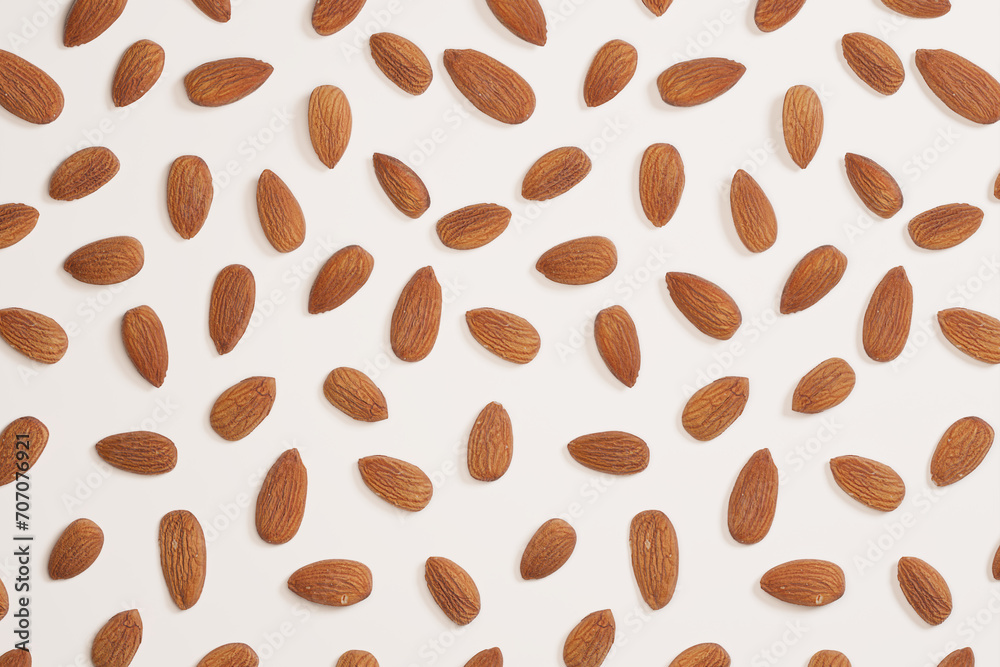 Assortment of Whole Almonds on a White Surface - Organic Nut Concept Assortment of Whole Almonds on a White Surface - Organic Nut Concept