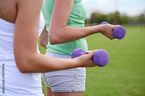Dumbbell in hands, weightlifting for exercise and muscle, athlete outdoor for sport and bodybuilding. Healthy, fitness equipment and strong people in park, bicep and bodybuilder with workout together