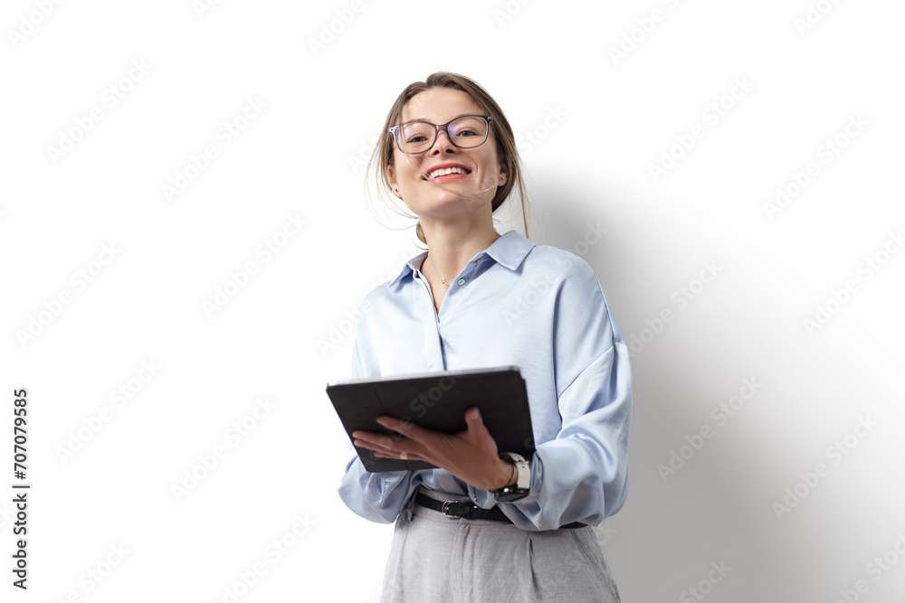 A cheerful businesswoman in a blue shirt holding a digital tablet, showcasing a blend of tech fluency and approachability A cheerful businesswoman in a blue shirt holding a digital tablet, showcasing a blend of tech fluency and approachability