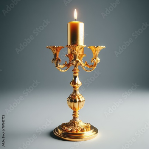 burning golden candle in a candlestick