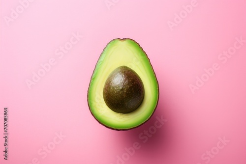 Fresh organic avocado cut in half to reveal its nutritional and natural benefits.