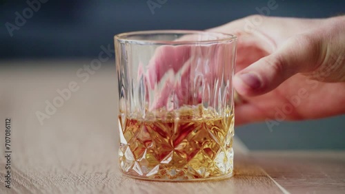 Hand Holding Whiskey Glass