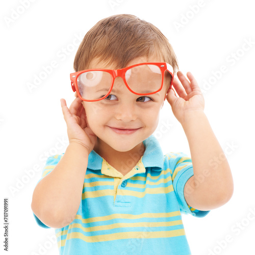 Child, boy and smile for glasses in studio, eyes and vision support by white background. Happy male person, kid and ophthalmology for eyecare, red spectacles and stylish fashion or humor and goofy