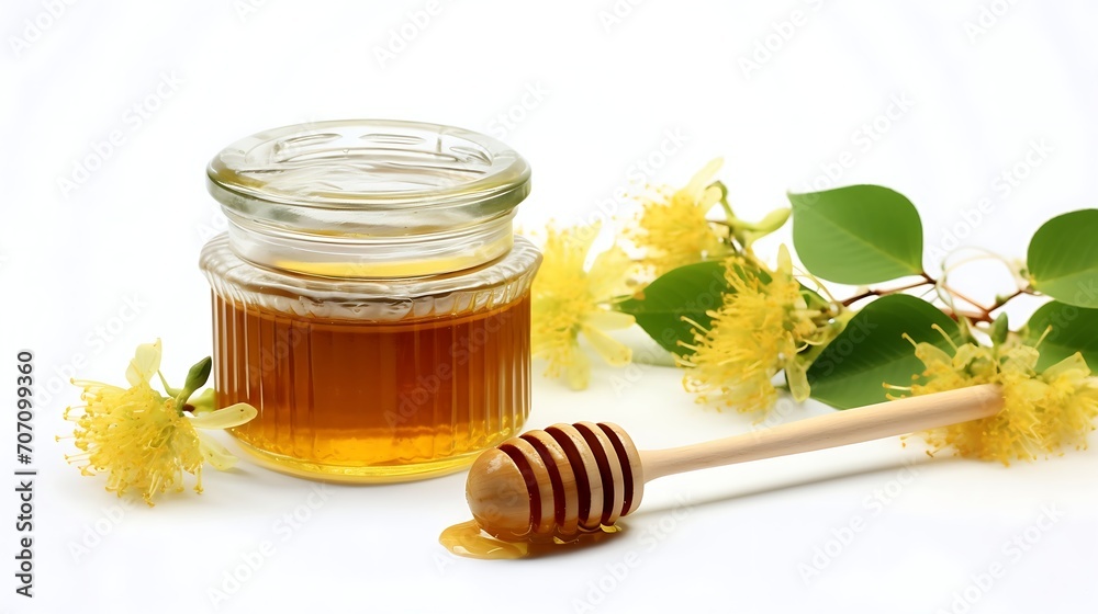 Jar of honey and jasmine flowers on a white background. Jar of honey and jasmine flowers on a white background.