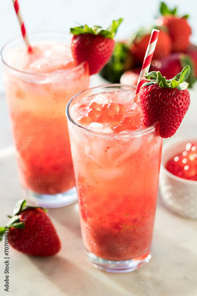 Glasses of refreshing strawberry lemonade with bubble popping pearls. Glasses of refreshing strawberry lemonade with bubble popping pearls.