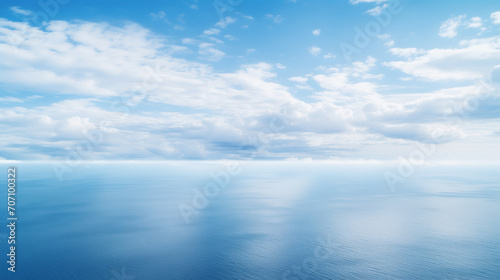 Blue sea and cloudy blue sky, blue sky with clouds, Blue sea water with sunny and cloudy sky, An aerial view of eternal blue sea or ocean with sunny and cloudy sky, Ai generated image © FH Multimedia
