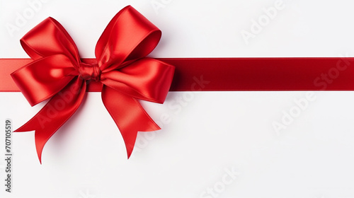 bright red ribbons tied in a bow on white background 