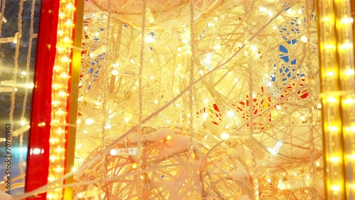 New Year Christmas city light street. Snowdrifts. Electric lighting design. Garlands LED yellow Christmas decorations. Garlands - spider and clip light. Flickering, blinking, glowing, shining bulbs  photo