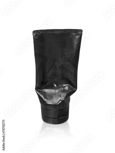 black plastic squeezed tube. Packaging for cosmetics, transparent background
