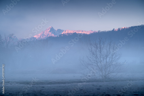 Illuminated peak of the Alps at morning.  © Tomasz