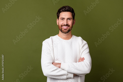 Photo of successful attractive confident man wear stylish clothes folded arms isolated on khaki color background