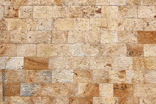 Wallpaper Mural a yellow beige natural stone wall of different sized stones, traditional crafts Torontodigital.ca