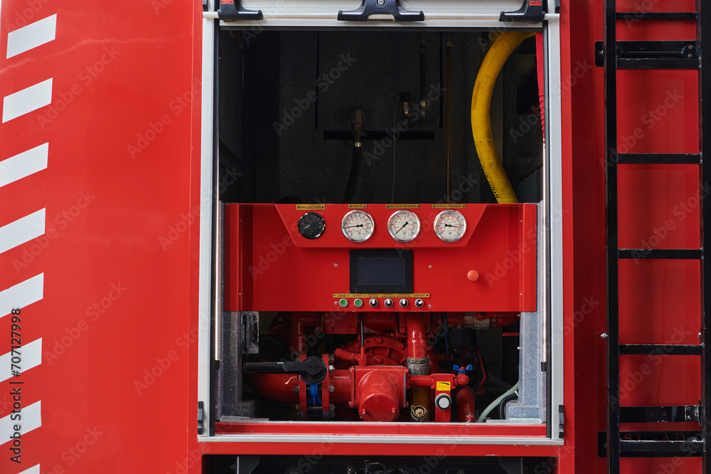 Close-up of essential firefighting equipment on a modern firetruck, showcasing tools and gear ready for emergency response to hazardous fire situations Close-up of essential firefighting equipment on a modern firetruck, showcasing tools and gear ready for emergency response to hazardous fire situations