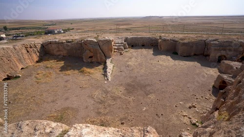 Ruins of rock cut building in Dara ancient city 4K Dara or Daras was an important East Roman fortress city in northern Mesopotamia on the border with the Sassanid Empire. photo
