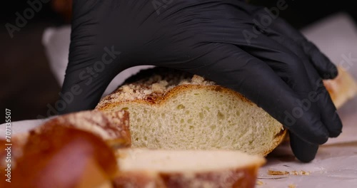 soft sweet bun with sprinkles on top, fresh white wheat bun close-up photo