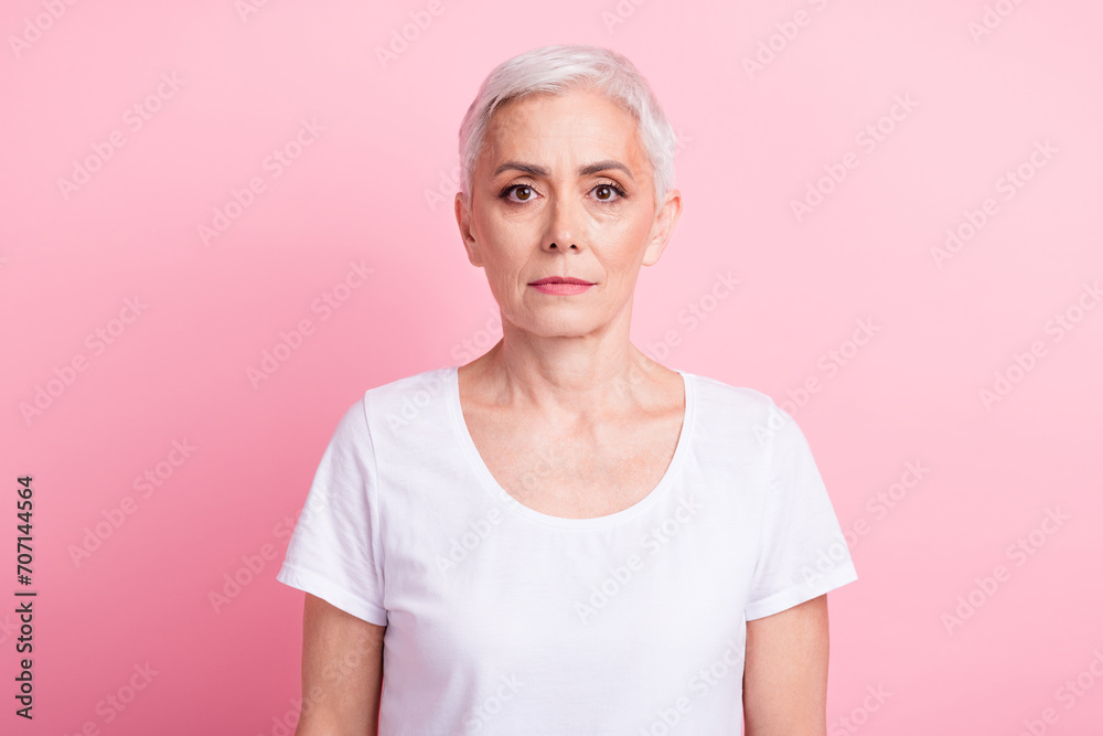Photo portrait of attractive pensioner woman look camera dressed stylish white clothes isolated on pink color background