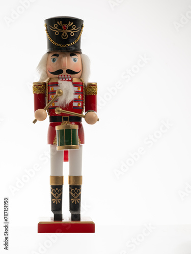Christmas Nutcracker Drumming soldier in uniform figurine isolated on a white background