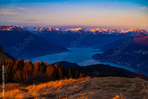 Panorama of Lake Como, photographed in winter, at sunset, from Monte San Primo, with the surrounding villages and mountains.