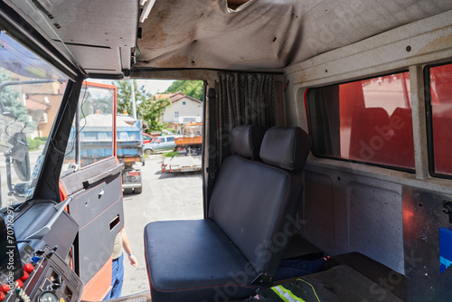 The close-up capture reveals the intricate details of the ergonomic seats and high-tech interior of a modern firefighting truck, showcasing a perfect blend of functionality and safety features