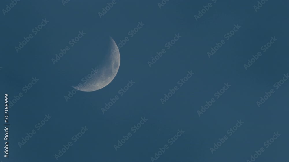 Half Moon in the sky behind the clouds Half Moon in the sky behind the clouds