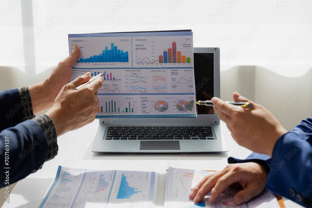Close up of Asian male company executives working together reviewing business in the office Close up of Asian male company executives working together reviewing business in the office