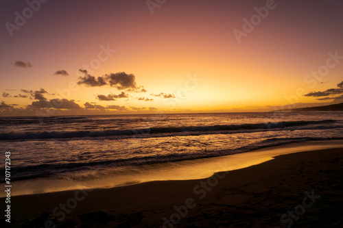 Sunset on the beach of L   tang-Sal    one of the rare beaches of the island made of volcanic sand  the result of a mixture of basalt and coral  Reunion Island