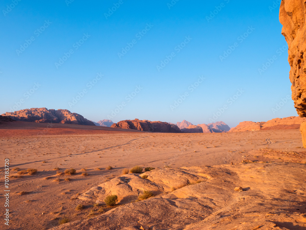 Fototapeta premium Journeys in the Wadi Rum desert in Jordan, between mountains and camels