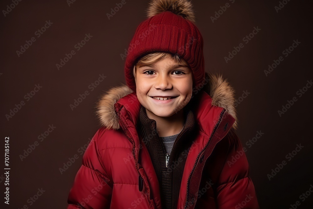 Portrait of a cute little boy in a warm jacket and hat Portrait of a cute little boy in a warm jacket and hat
