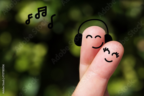 Happy finger, couple in love, Smile emoticon, Face emoticon on blurred park background. 