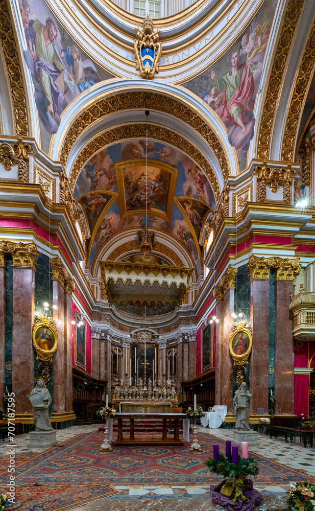 view of the central nave and altar in the Metropolitan Cathedral of St. Paul in Mdina