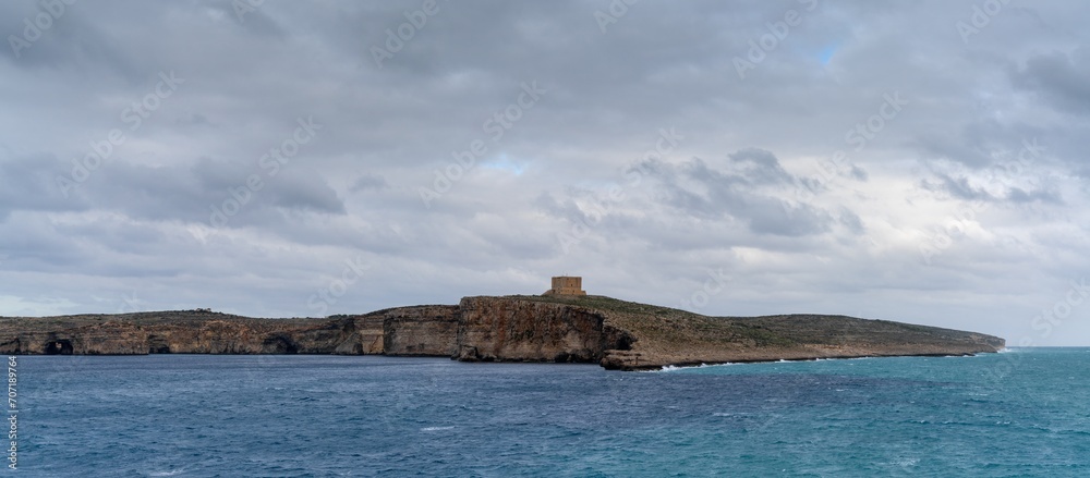 panorama view of Comino Island and watchtower in the Gozo Channel in Malta
