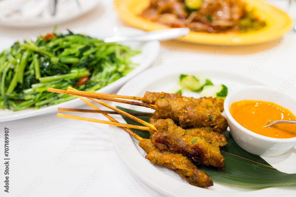 Check meat satay dish in restaurant Check meat satay dish in restaurant