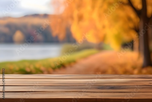 The empty wooden table with blur background of autumn