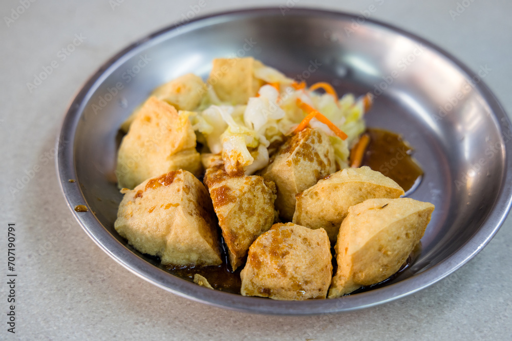 Deep fry stinky tofu on the dish in Taiwanese restaurant Deep fry stinky tofu on the dish in Taiwanese restaurant