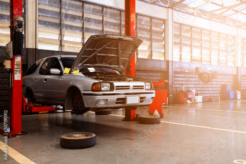 car repair in garage service station with soft-focus and over light in the background