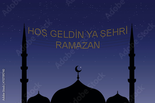 Hoş geldin ya şehri Ramazan (Translate: Welcome month of ramadan) lettering hanging on Mosque's mahya vector. Mahya is an enlightenment arrangement during ramadan nights between two minarets.