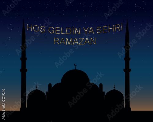 Hoş geldin ya şehri Ramazan (Translate: Welcome month of ramadan) lettering hanging on Mosque's mahya vector. Mahya is an enlightenment arrangement during ramadan nights between two minarets.