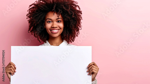 Joyful African American Woman Holding Blank Sign, Marketing Concept photo