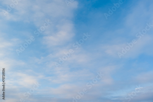 Photo texture of blue sky with clouds.