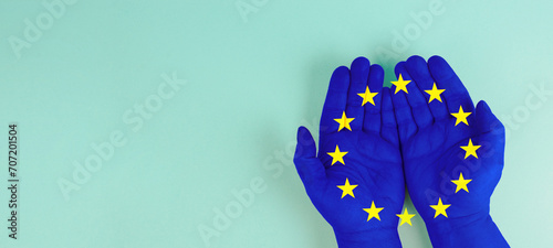 Hand with EU flag, european union, cooperation between the countries of Europe, Association of states