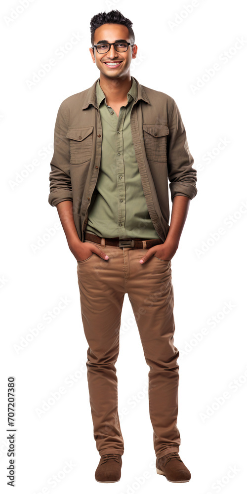 Fototapeta premium Full body portrait of young smiling arabian man stands with hands in pockets isolated on transparent background. Wearing olive shirt, brown trousers and glasses. Design element for banner, advertising