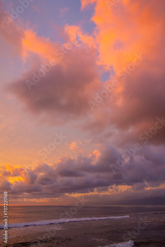 Extremely colorful and sunset and beautiful cloudscape over the Pacific Ocean, with Malibu in the background, taken from  Venice Beach Fishing Pier.