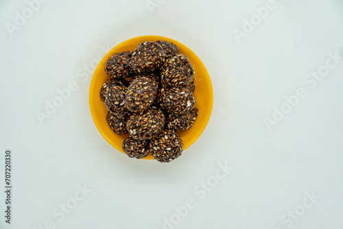 Sesame Ladoo aka til ko ladoo for Makar Maghe Sankranti  dipped in Jaggery for Hindu festival photo