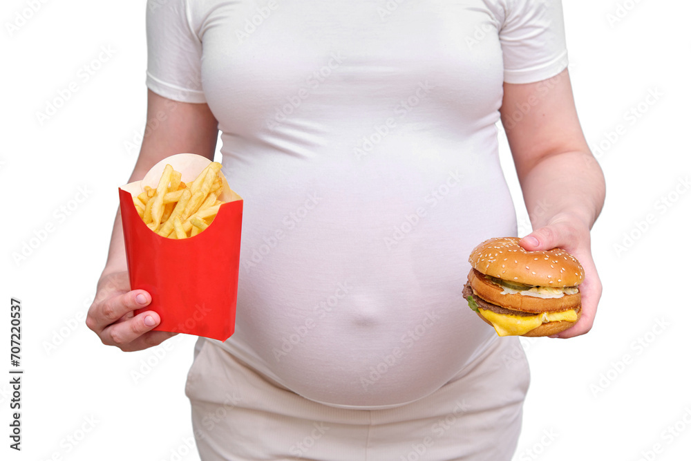 Pregnant woman with hamburger and fries, isolated on a white background Pregnant woman with hamburger and fries, isolated on a white background
