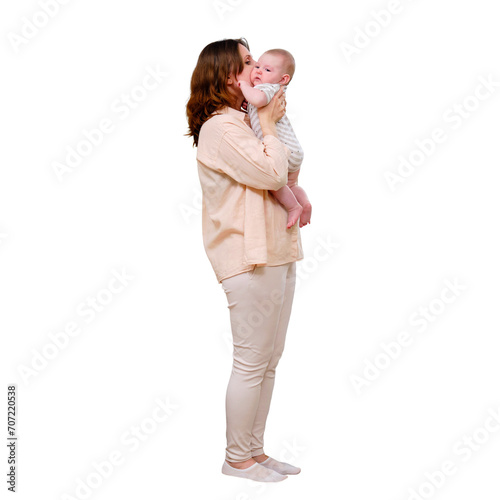 Adult woman kissing infant with baby in home living room near autumn window, isolated on a white background photo