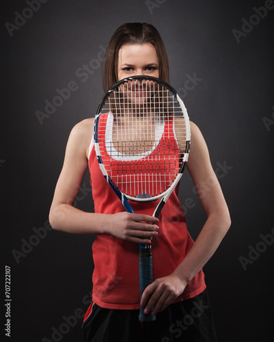 Portrait of sporty girl tennis player with racket © Dasha Petrenko