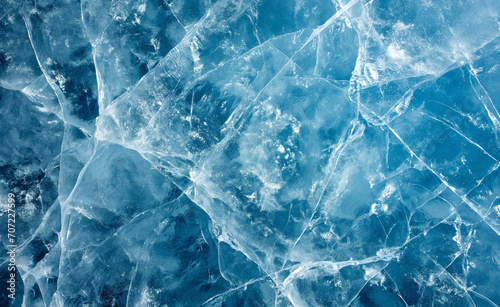 Abstract ice background. Blue background with cracks on the ice surface.